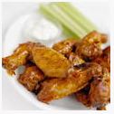 a plate of chicken wings with celery