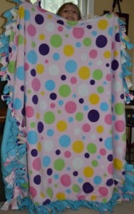 How to Make a Fringed Fleece Blanket a pink and purple polka dot blanket