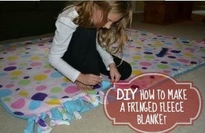 A girl making a polka dot blanket