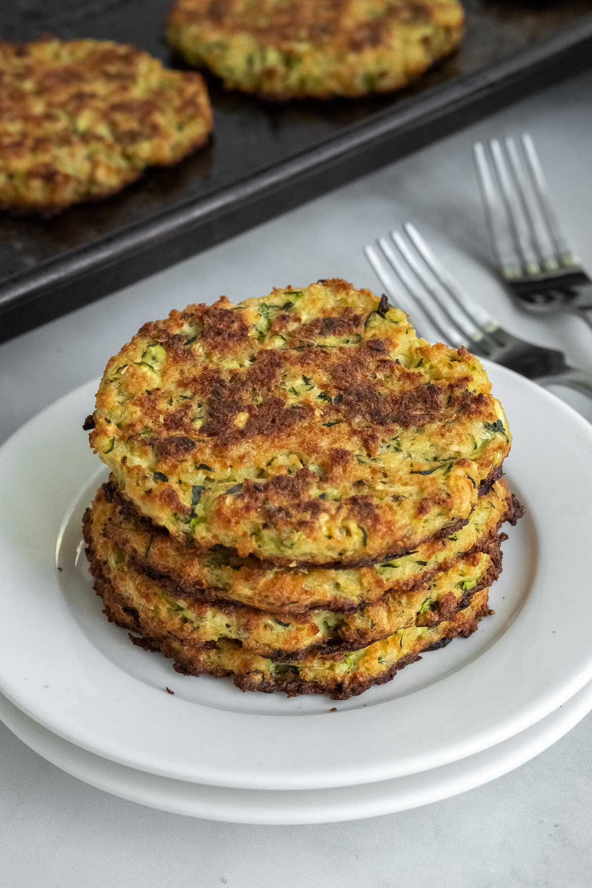 Baked Zucchini cakes on a white plate