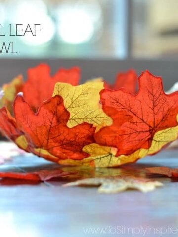 Fall colored leaves in the shape of a bowl with text overlay - DIY fall leaf bowl