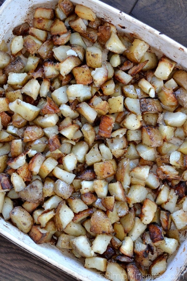 a baking dish full of diced roasted potatoes