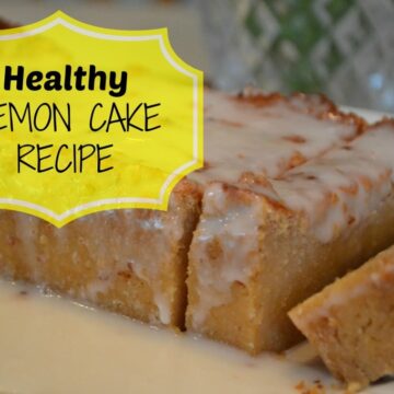 glazed lemon cake loaf with two slices cut on a white plate