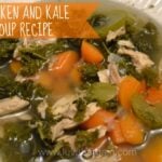 A bowl of Chicken and Kale soup with carrots and celery