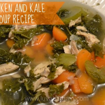 A bowl of Chicken and Kale soup with carrots and celery