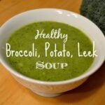 a white bowl of creamy broccoli soup