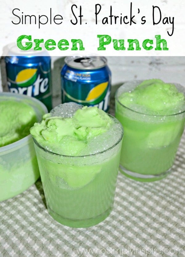 Two glasses of Green Punch with cans of soda in the background.