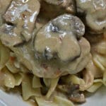 cooked mushroom and chicken in a cream sauce over egg noodles