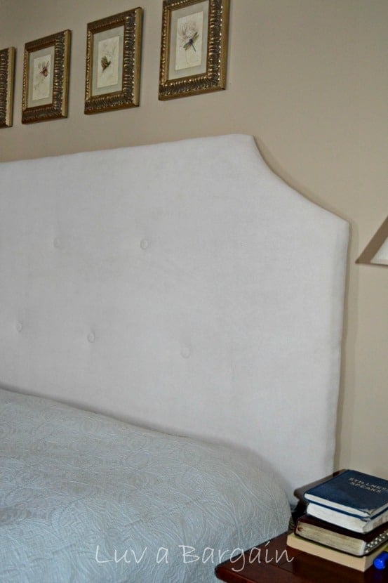 A cream upholstered headboard