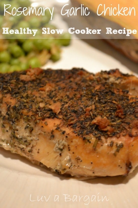 Healthy Slow Cooker Rosemary Garlic Chicken chicken breasts topped with dried rosemary and garlic