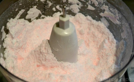 A close up of pink laundry detergent 
