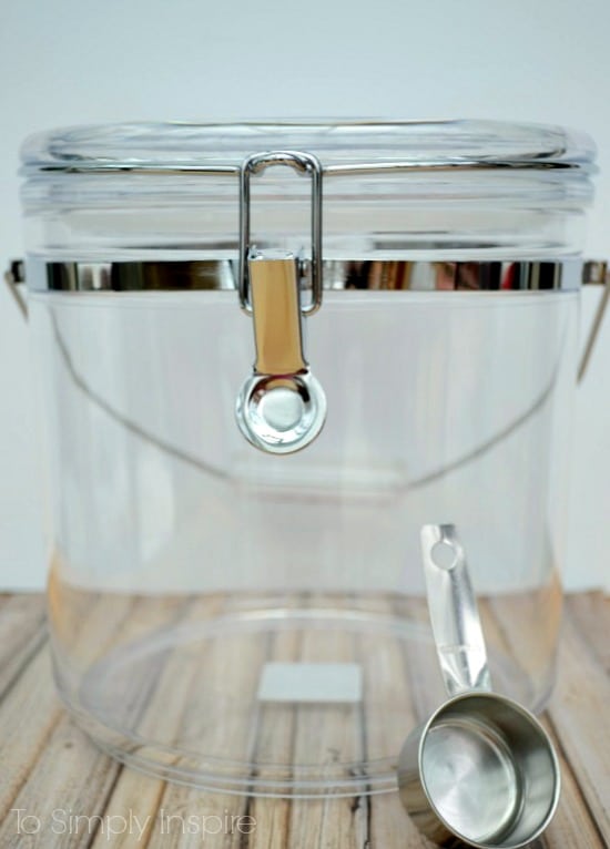 an empty plastic container with a metal scoop