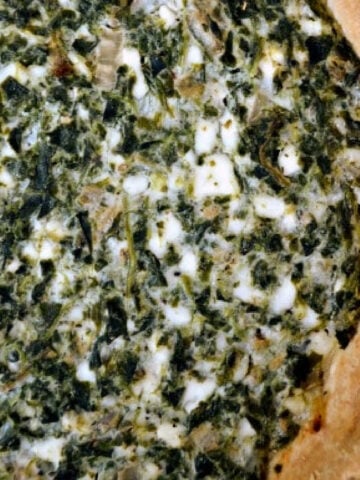 closeup of spinach pie in a pie crust