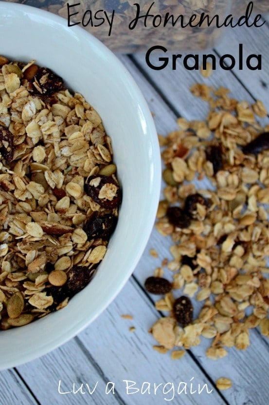 a white bowlful of granola with raisins