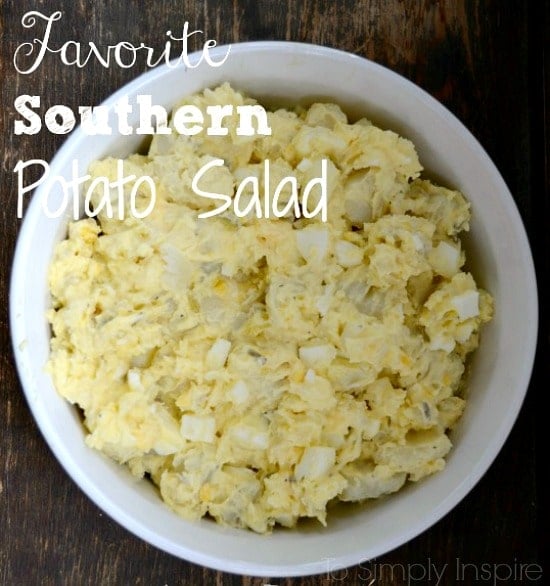Potato Salad recipe with hard boiled eggs in a white bowl with text overlay class=