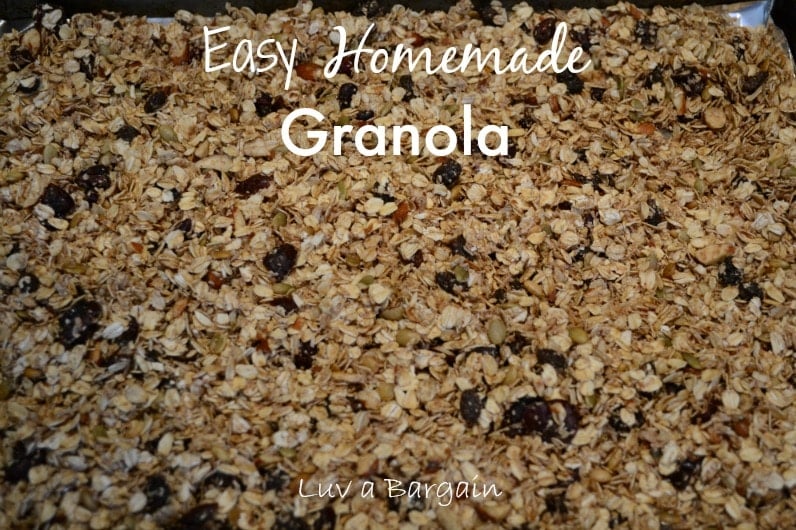 homemade granola with raisins on a baking sheet