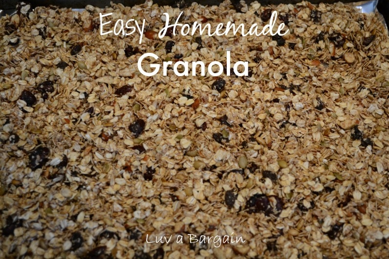 homemade granola with raisins on a baking sheet