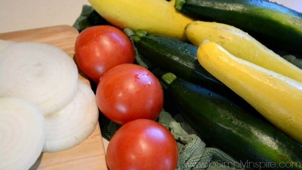 Tomatoes, zucchini, summer squash and onions for a zucchini and squash recipe