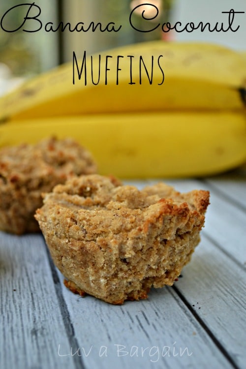 banana coconut muffins on a grey wood table with bananas