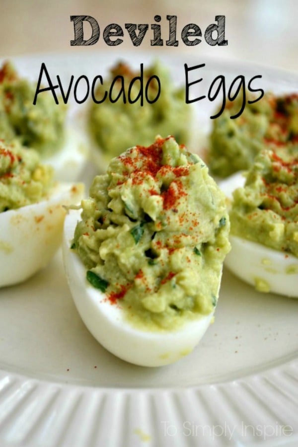 A close up of a white plate with Avocado Deviled Eggs