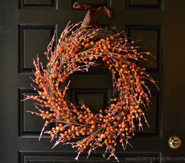 Orange and Red Berry Fall Wreath on a Black Door