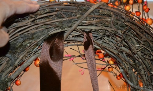 ribbon on the backside of a grapevine wreath 