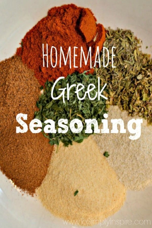 a plate full of piles of spices to make homemade greek seasoning with text overlay