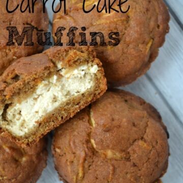 carrot cake muffins with one cut in half and filled with cream cheese frosting