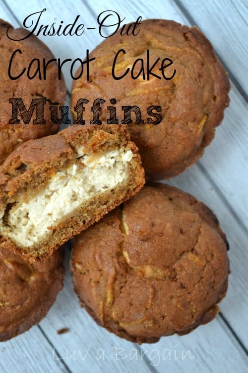 carrot cake muffins with one cut in half with cream cheese frosting inside