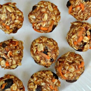 several carrot cake energy bites on a white plate