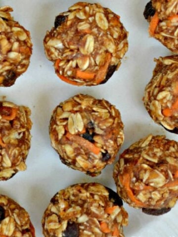 several carrot cake energy bites on a white plate