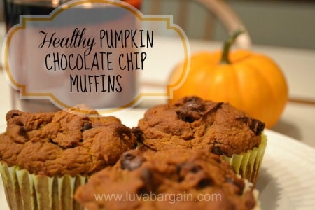 three pumpkin chocolate chip muffins on with a min pumpkin