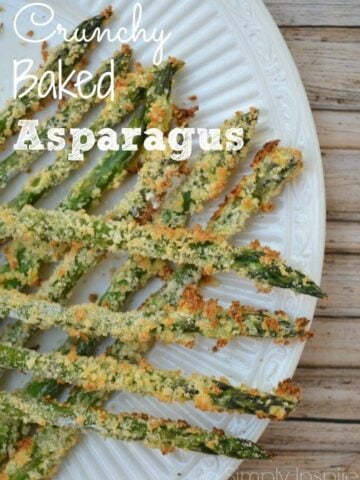 asparagus coated in panko breadcrumbs on a white plate