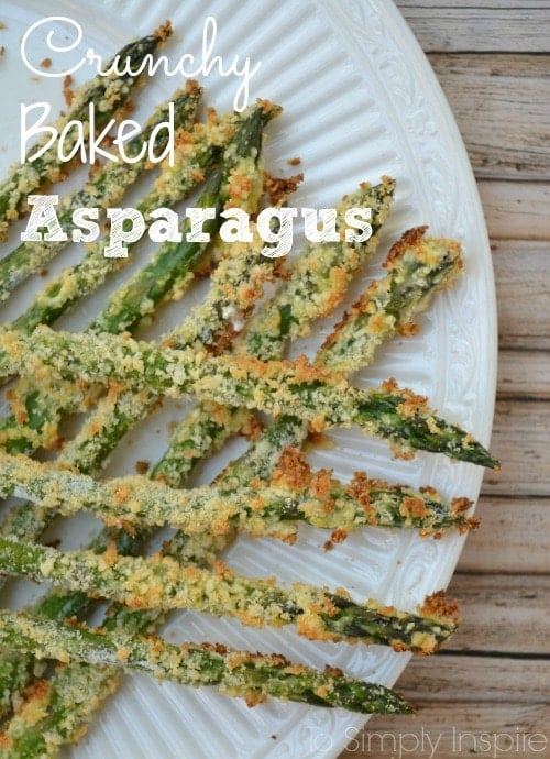 This Crunchy Baked Asparagus recipe is an easy new way to cook and enjoy a healthy favorite. So delicious and it's asked for weekly in my house! Baked Asparagus with a crunchy topping on a white plate.