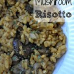closeup of mushroom risotto in a white bowl
