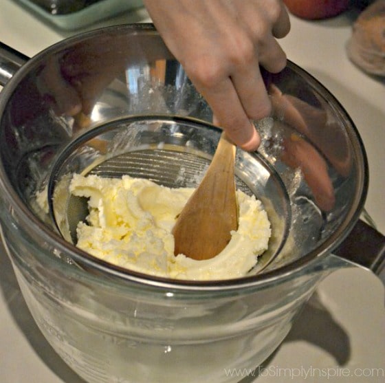a strainer with butter