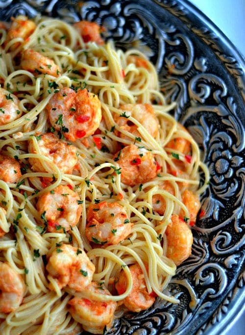 shrimp and pasta in a big silver bowl