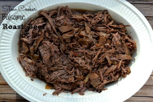 shredded roast beef in a white oval bowl
