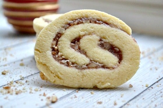 A close up of a raspberry pecan pinwheel sugar cookie