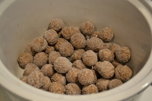 frozen meatballs in a white crockpot