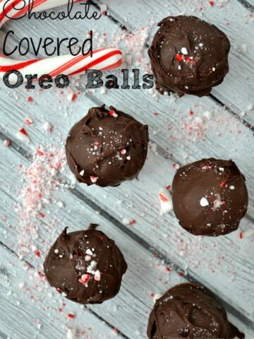 Oreo Balls on a table with crushed candy canes