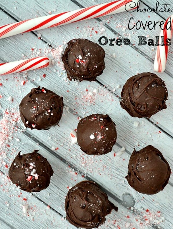 Oreo Balls recipe on a table surrounded by crushed candy canes