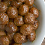 white bowl full of grape jelly meatballs