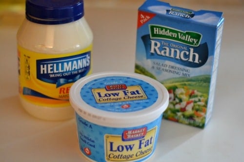 cottage cheese, mayonnaise and ranch dressing packets on a counter