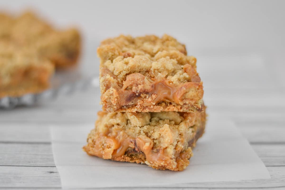 A close up of a stack of two Carmelita dessert bars