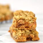 A close up of a stack of two Carmelita dessert bars