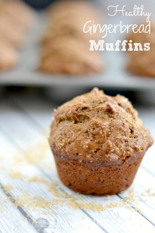 A close up of a coffee cake muffins on a light grey wood table