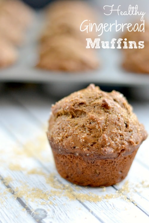 A close up of a coffee cake muffins on a light grey wood table