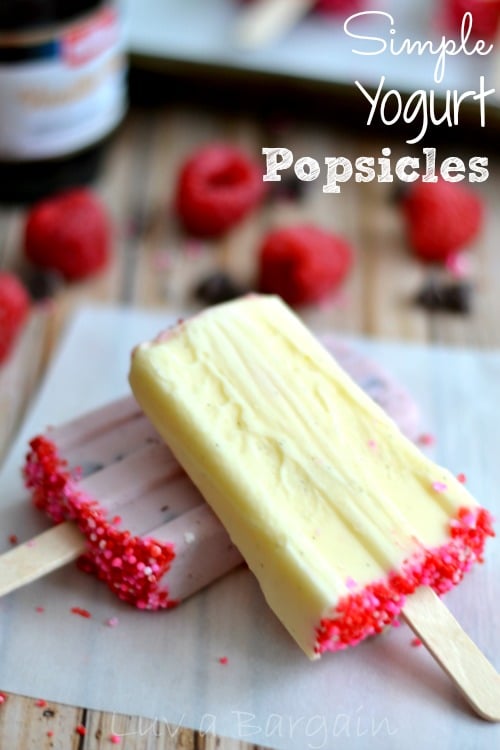 yellow and pink yogurt popsicles with hot pink sprinkles on the the bottoms