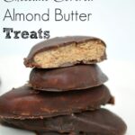 a stack of chocolate covered almond butter treats
